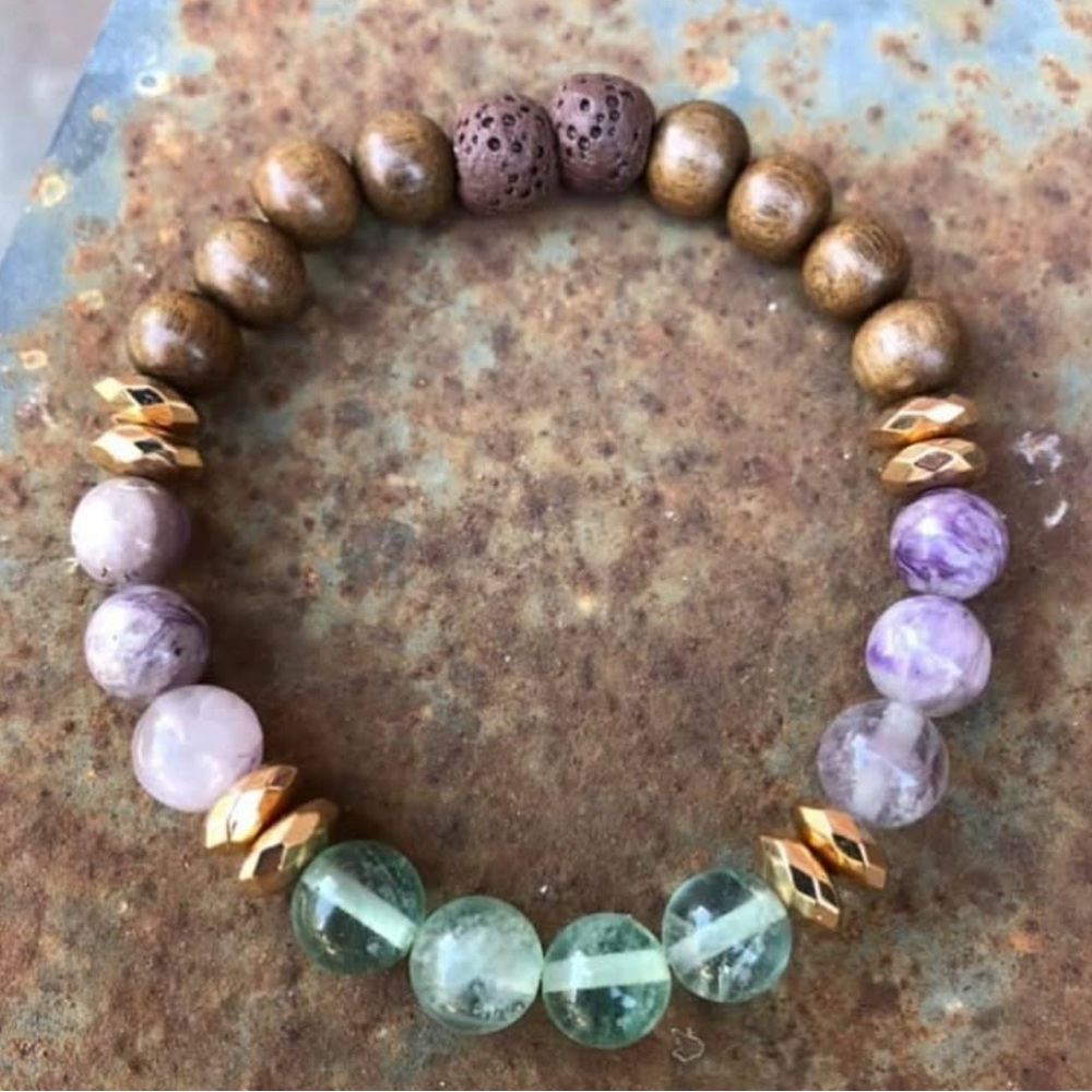 Beaded Bracelet Flourite, amethyst, rosewood, gold tone hematite, and lava.